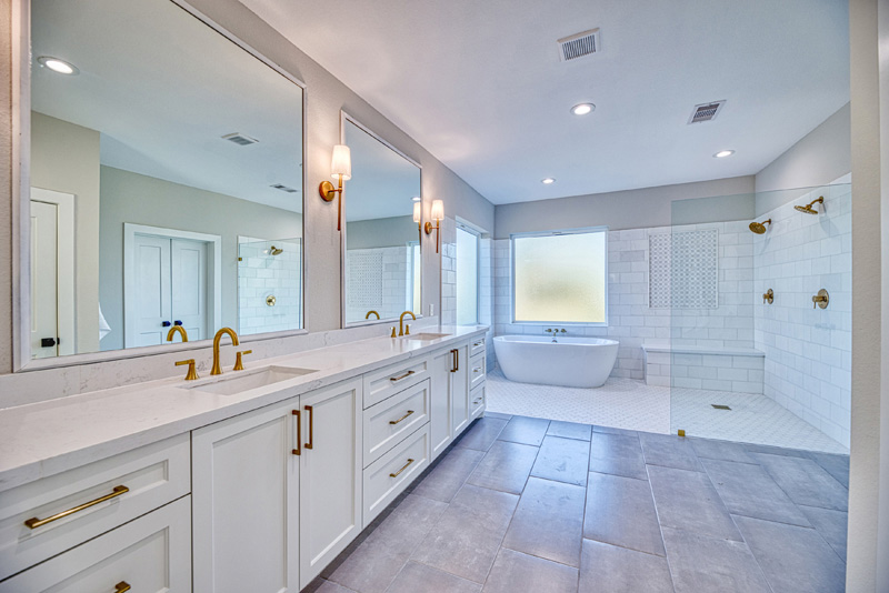 Custom primary bathroom with stunning marble tile wet area